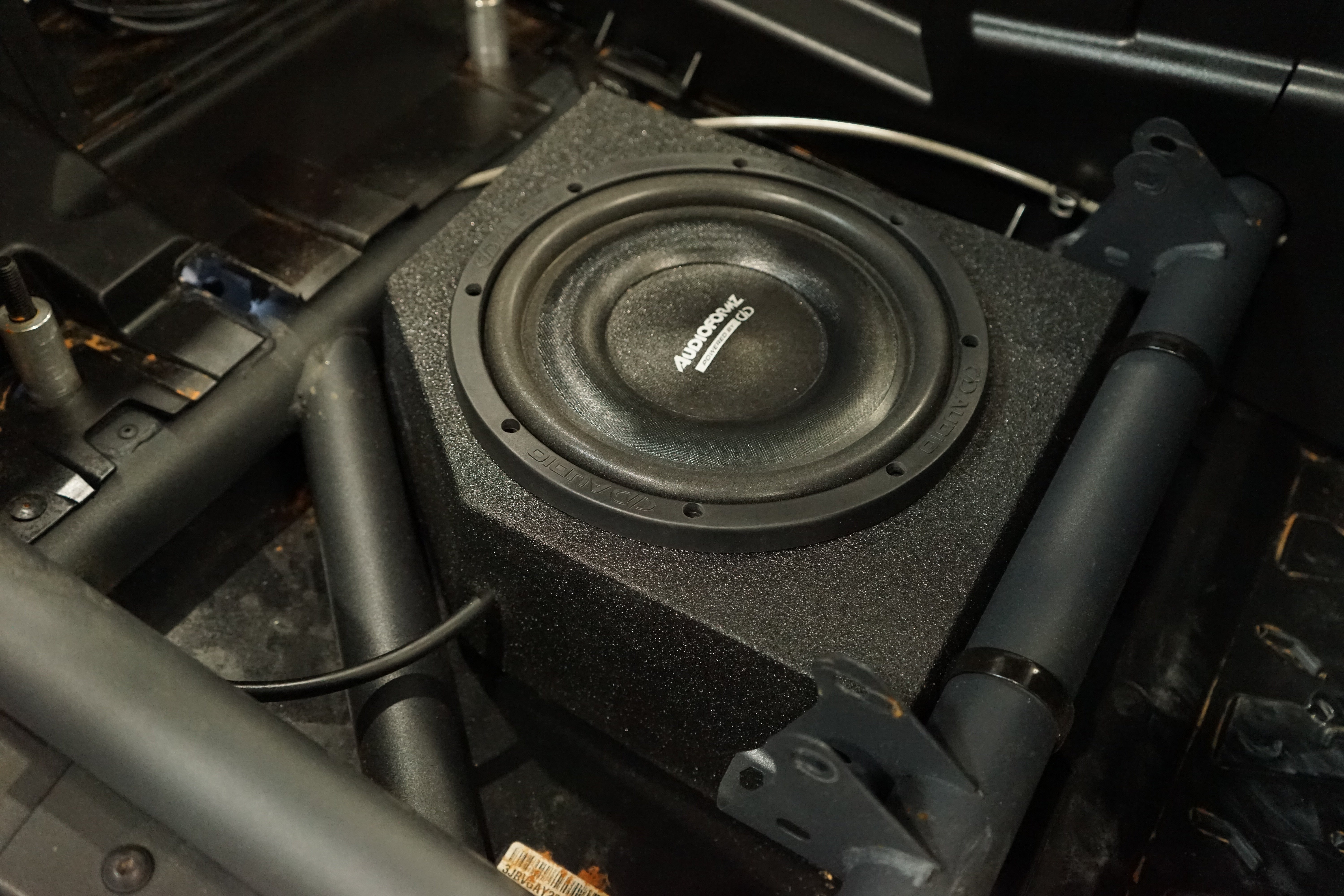 Jeep wrangler under seat best sale subwoofer box